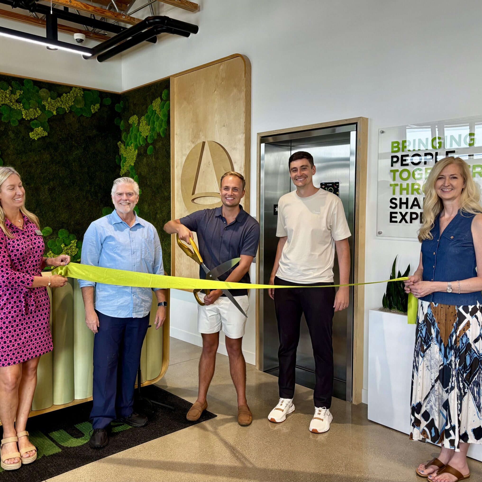 Ribbon cutting celebration a Ludus.